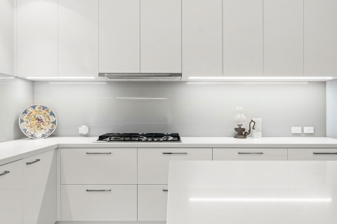 Aspendale Gardens-Kitchen renovation Sleek glass splash back with LED lighting strip.